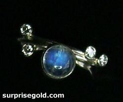 6mm moonstone and four diamonds