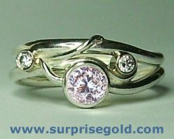  conflict free diamond engagement ring with two smaller diamonds