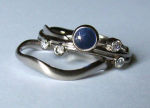 white gold, one sapphire and four diamonds