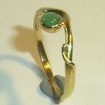 delicate emerald ring with side tendril