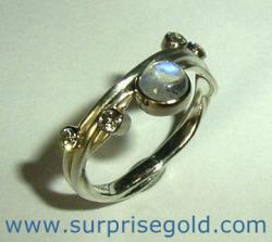 moonstone engagement ring with four diamonds