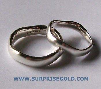 matching pair of wavy wedding rings