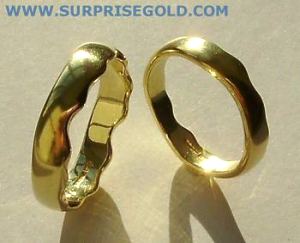 yellow gold matching wavy wedding rings