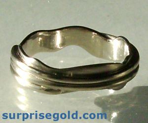 a man's wedding ring in the clouds design