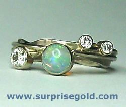 5mm opal with three diamonds
