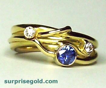 sapphire engagement ring with diamonds in yellow gold