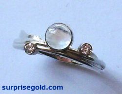 5mm moonstone and two diamonds