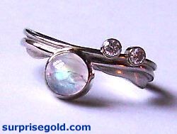 moonstone and two diamonds to one side