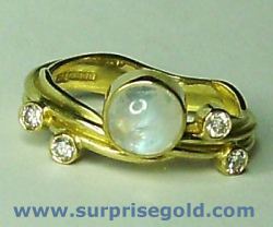 6mm moonstone and four diamonds